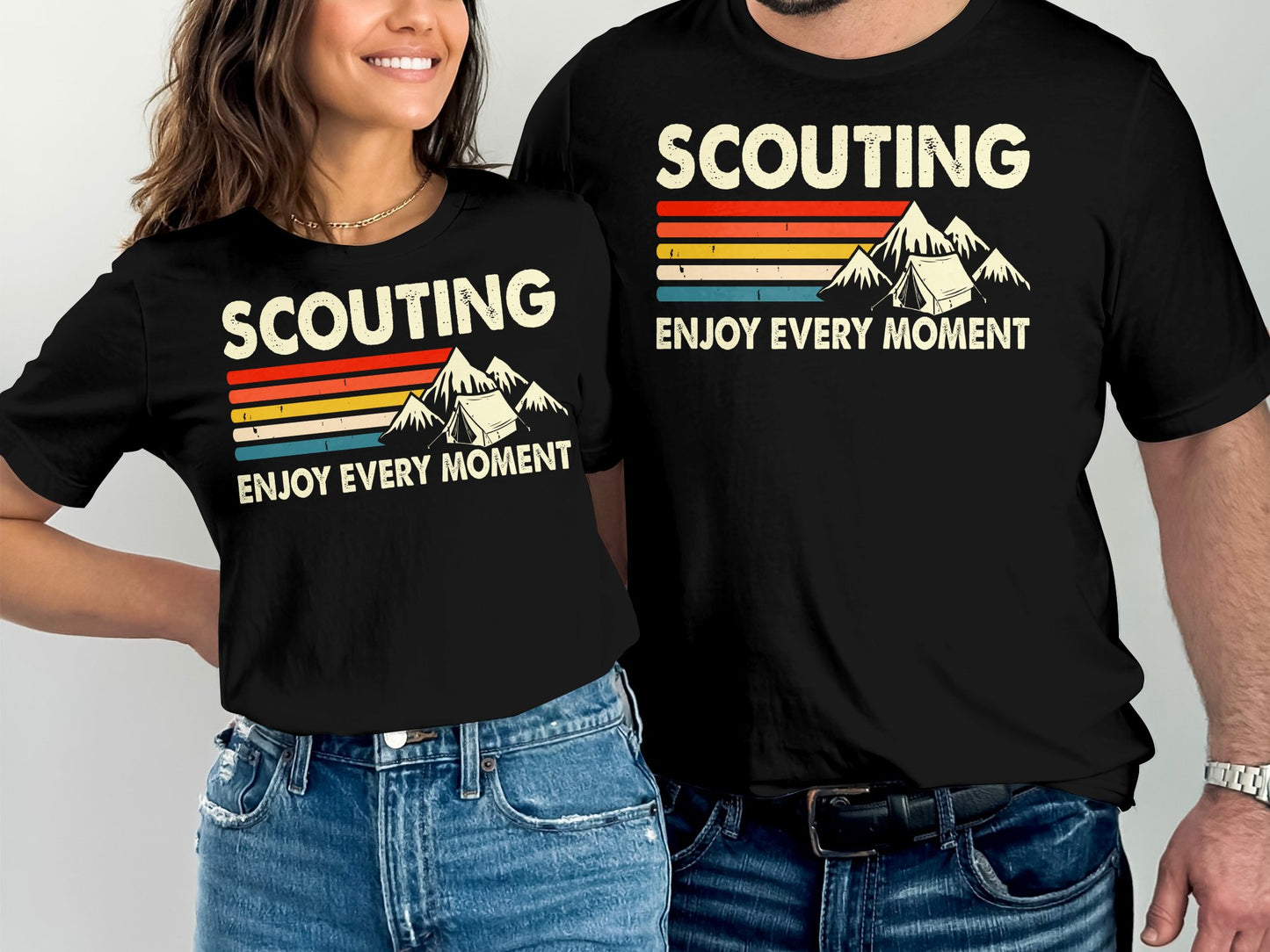 Two people wear black t-shirts with "SCOUTING ENJOY EVERY MOMENT" and a mountain graphic.