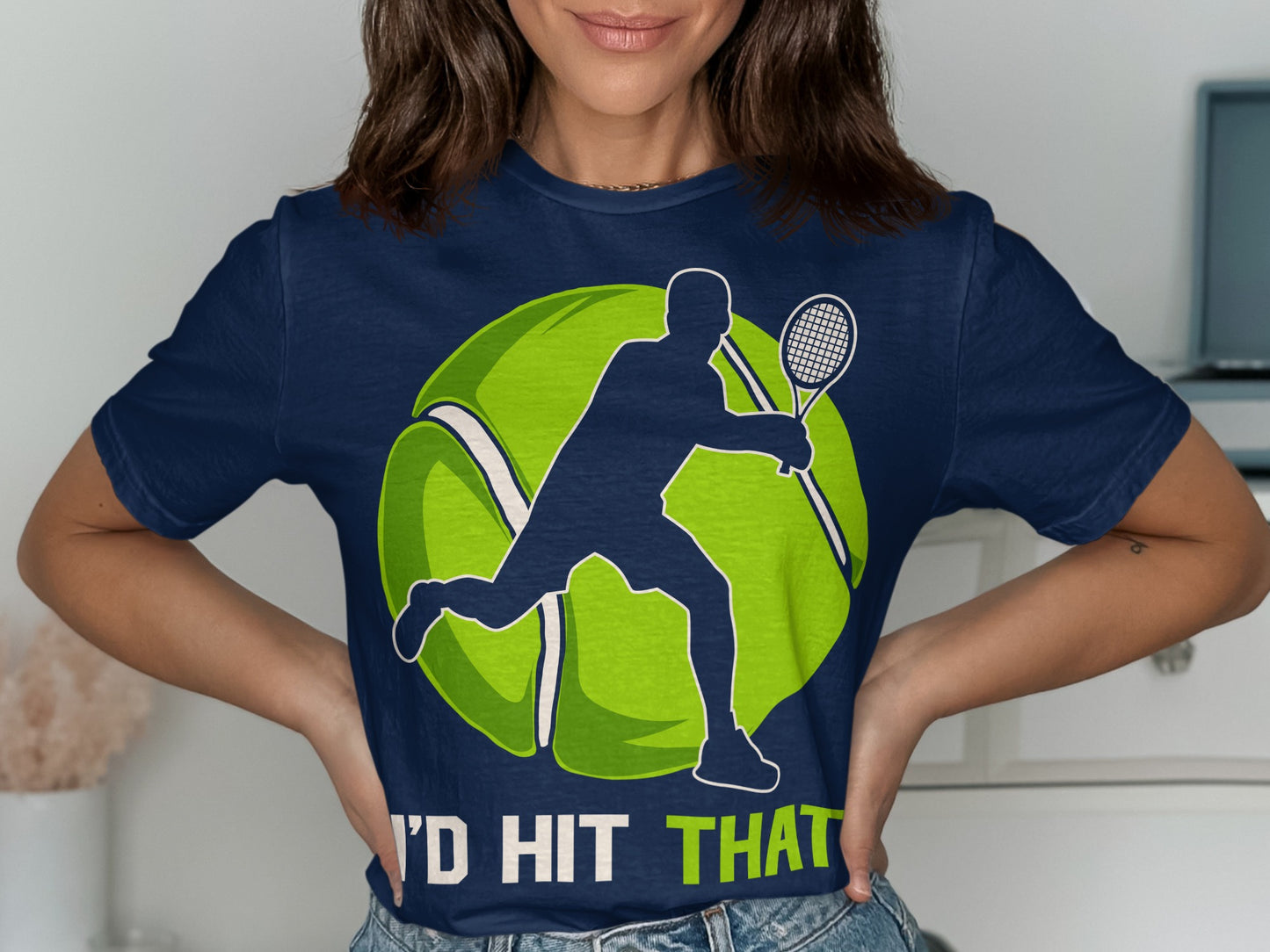 Tennis player silhouette on a large tennis ball, text "I'D HIT THAT".