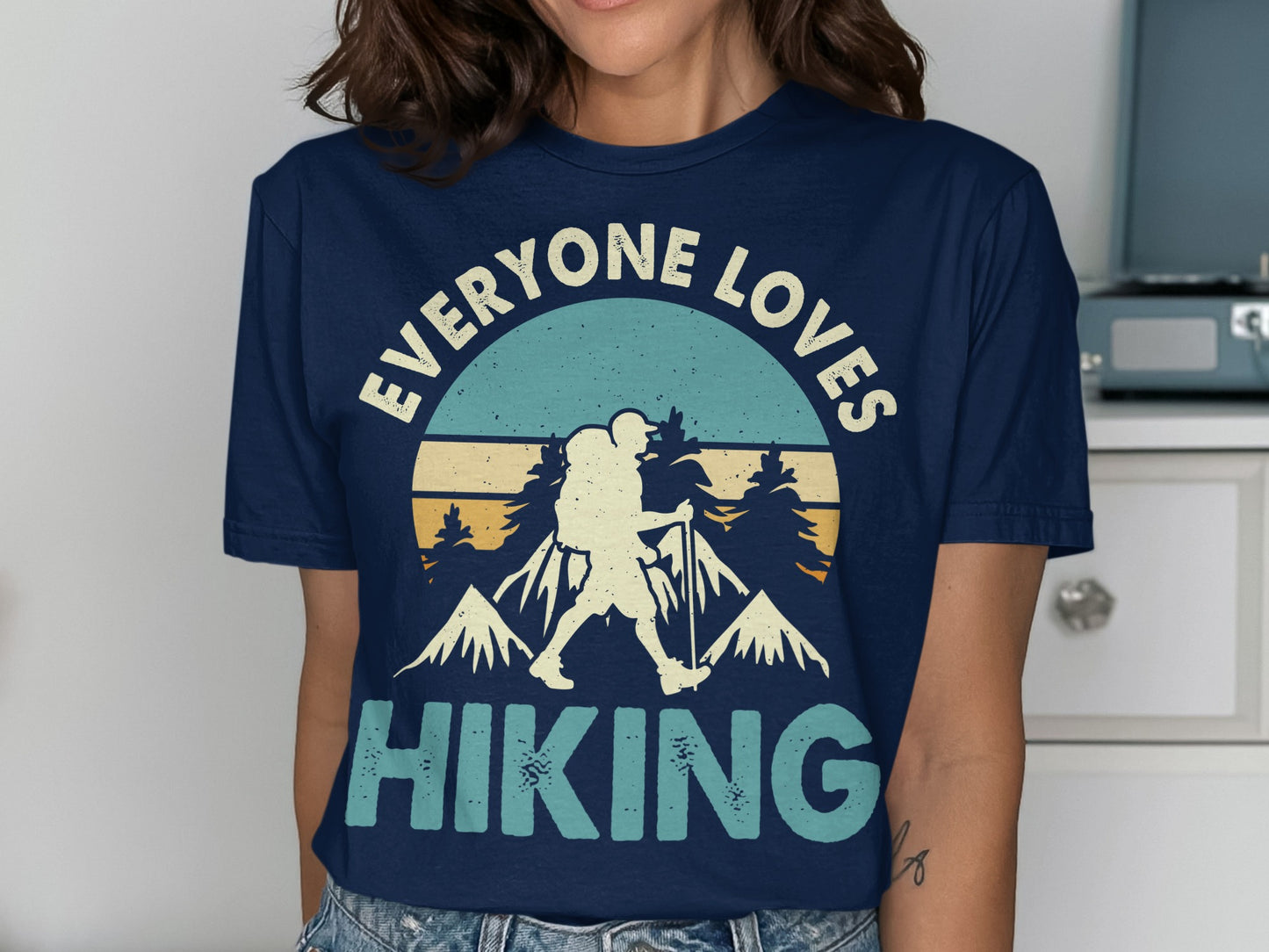Navy t-shirt with "EVERYONE LOVES HIKING" text and mountain graphic.