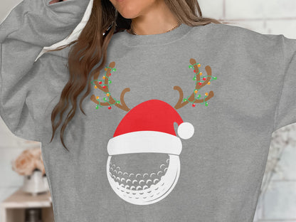 Grey sweatshirt with a Christmas-themed golf ball graphic.