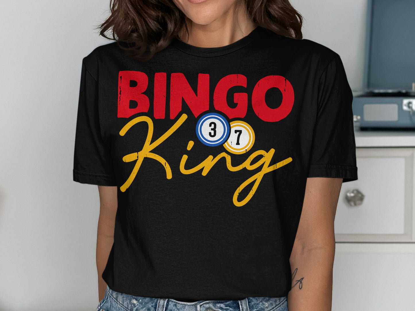 Black t-shirt with red "BINGO" and yellow "King" with bingo balls.