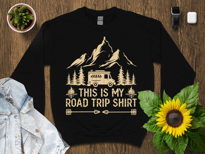 Black t-shirt with "This is my road trip shirt" and a camper van design.