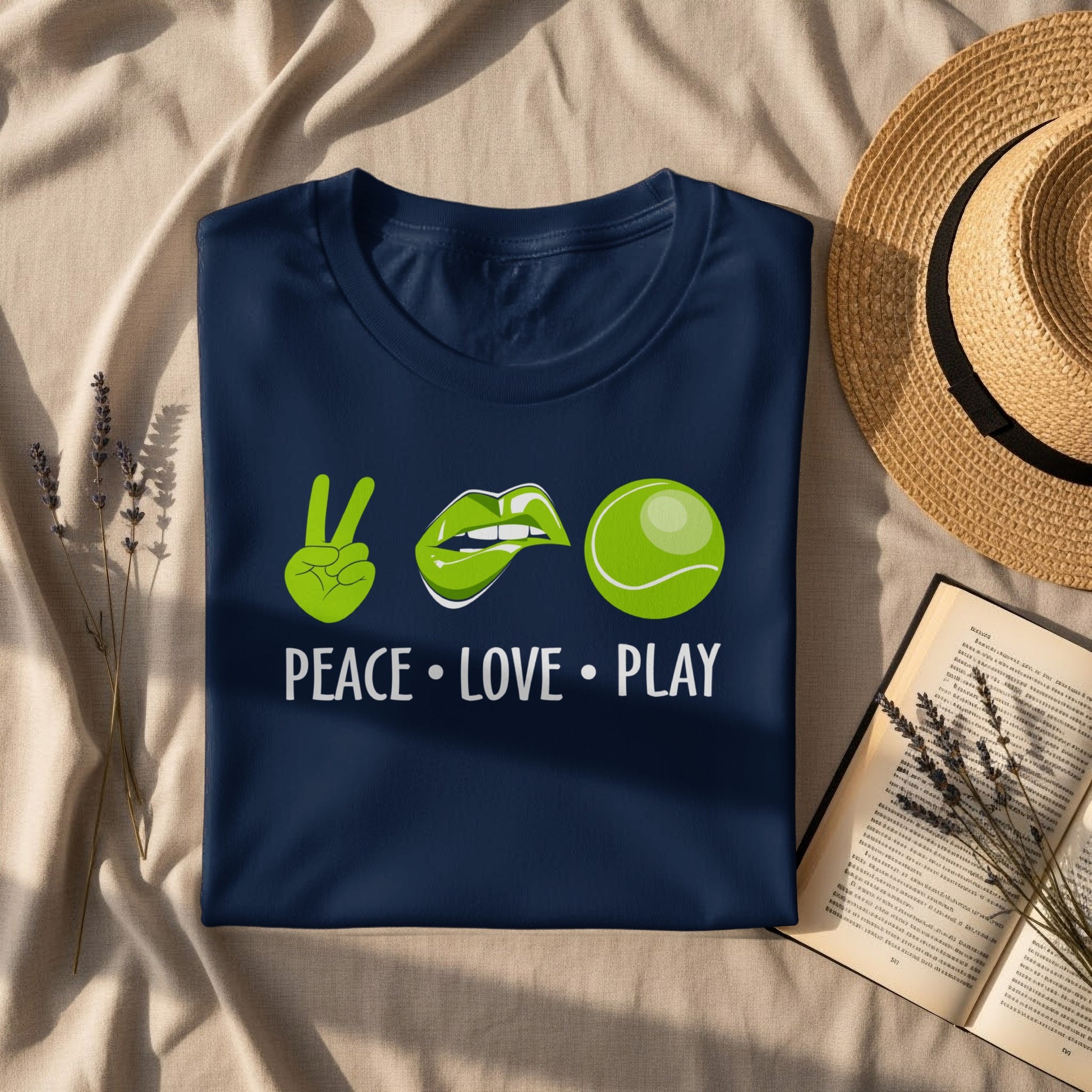 Navy t-shirt with peace sign, lips, and tennis ball graphic, "Peace. Love. Play."