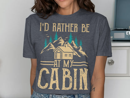 T-shirt with "I'd rather be at my cabin" text and cabin illustration.