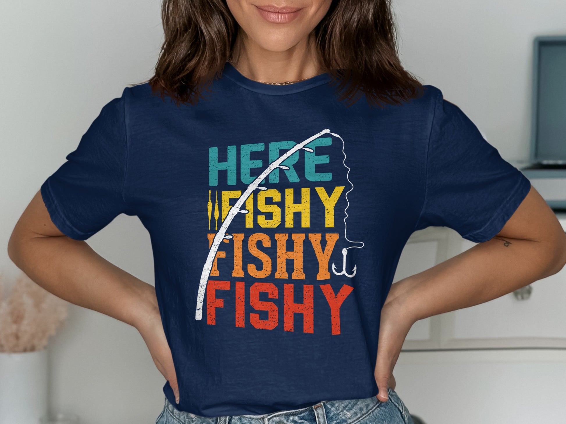 Navy t-shirt with "Here Fishy Fishy Fishy" text and fishing rod graphic.