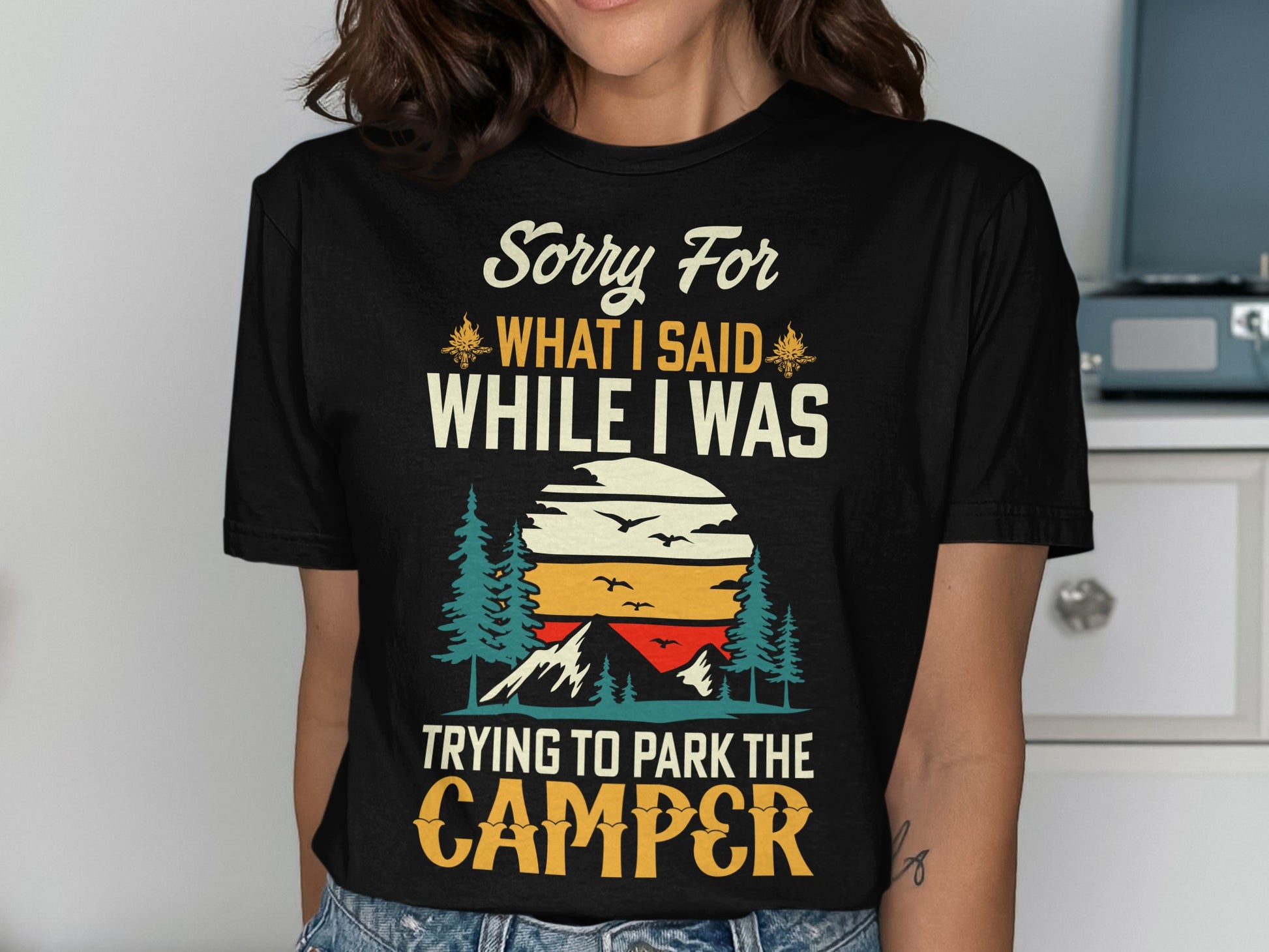 Black t-shirt with "Sorry for what I said while I was trying to park the camper" text.