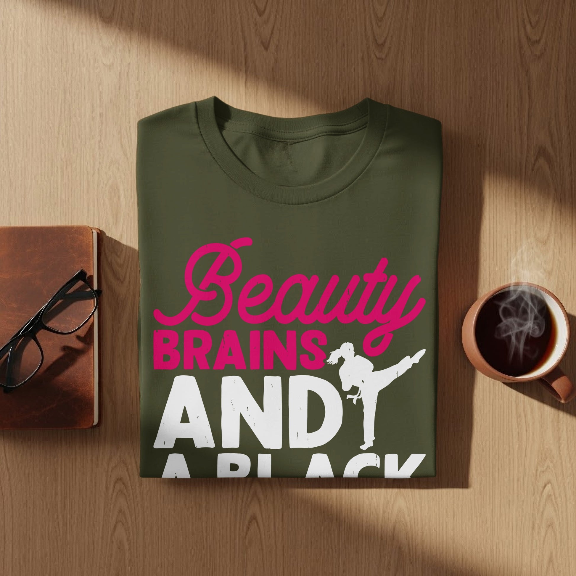 Green t-shirt with pink "Beauty Brains" and white "AND A BLACK BELT" text.