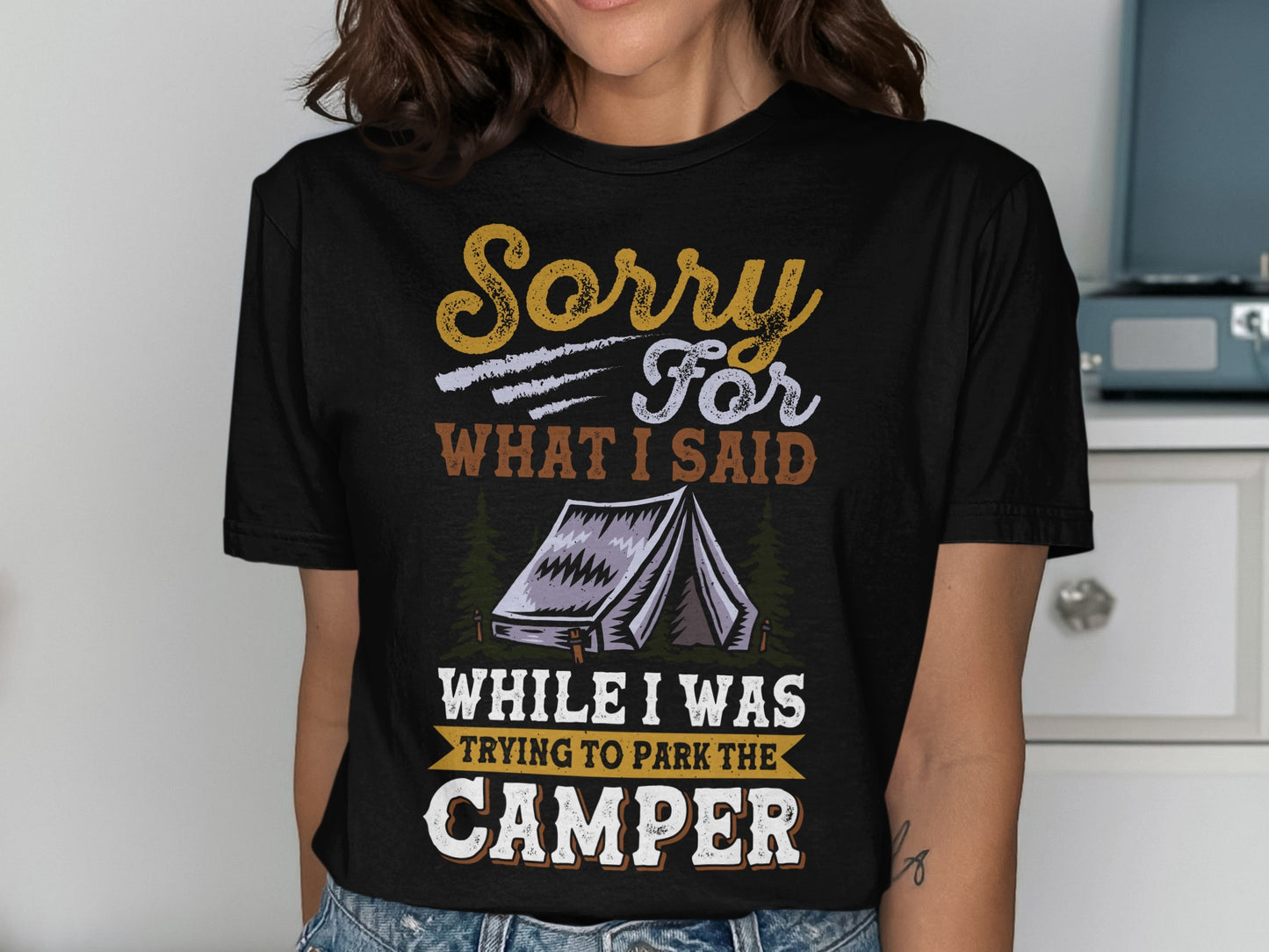 Black t-shirt with "Sorry For What I Said While Trying To Park The Camper" text and tent graphic.