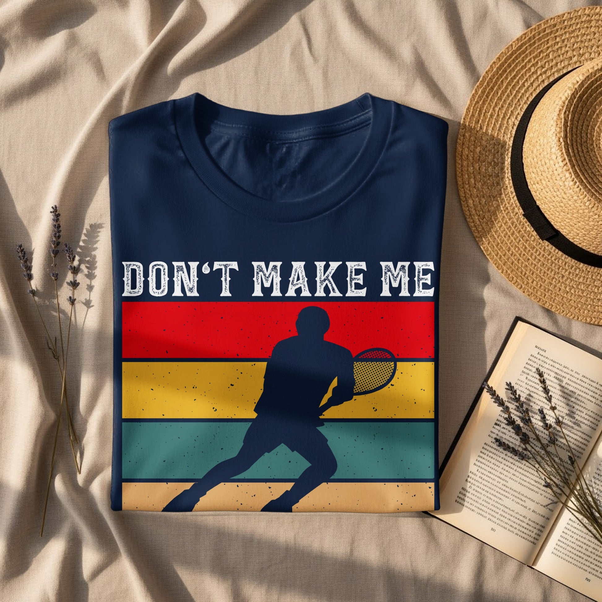 Navy t-shirt with "DON'T MAKE ME" and tennis player graphic.
