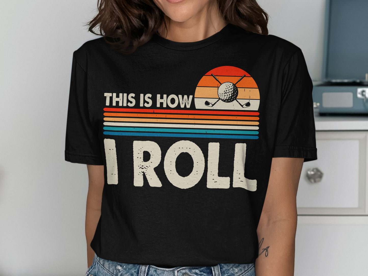 Black t-shirt with "This is how I roll" and golf imagery.