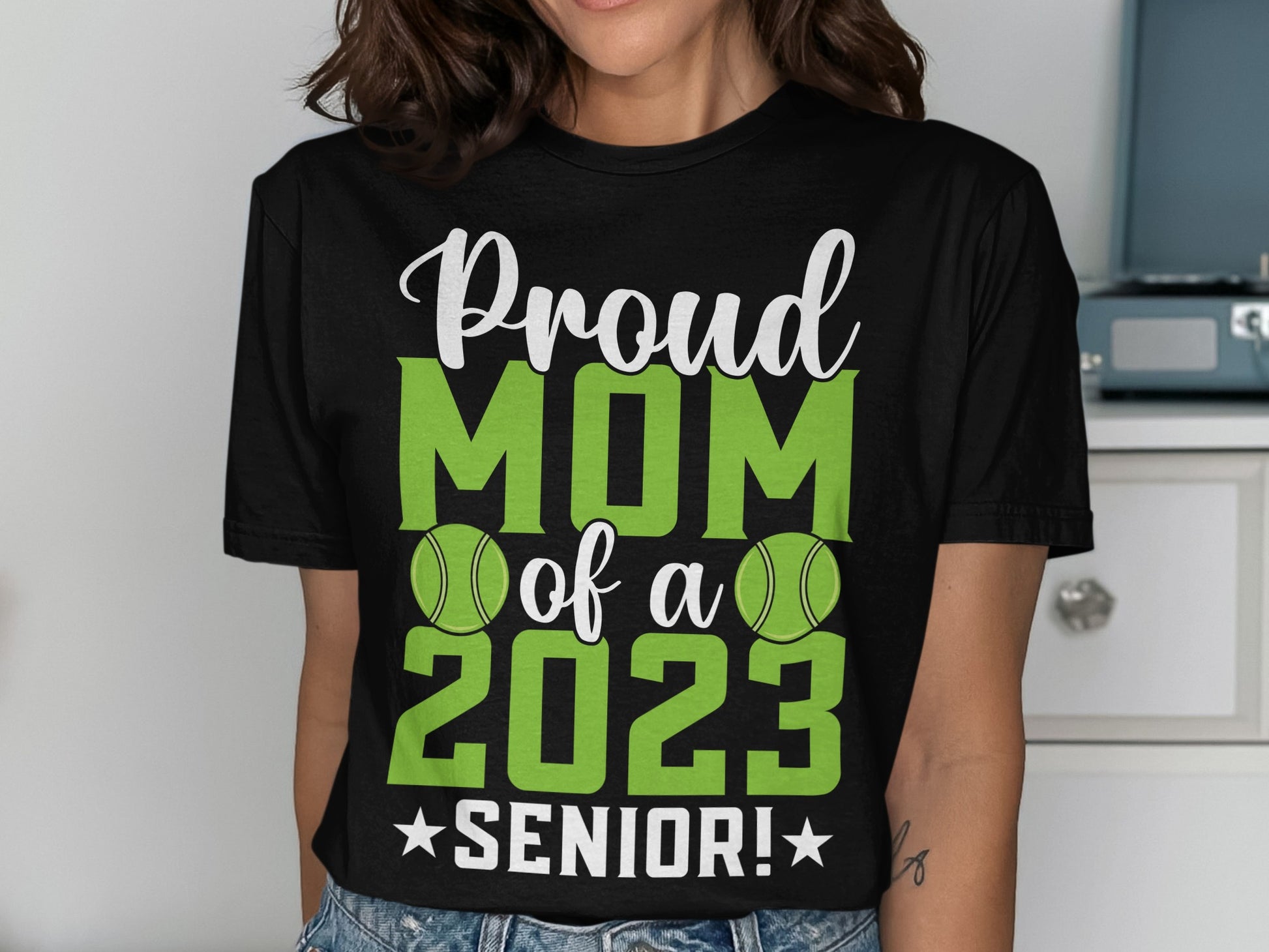 Black t-shirt with "Proud MOM of a 2023 SENIOR!" and tennis balls.