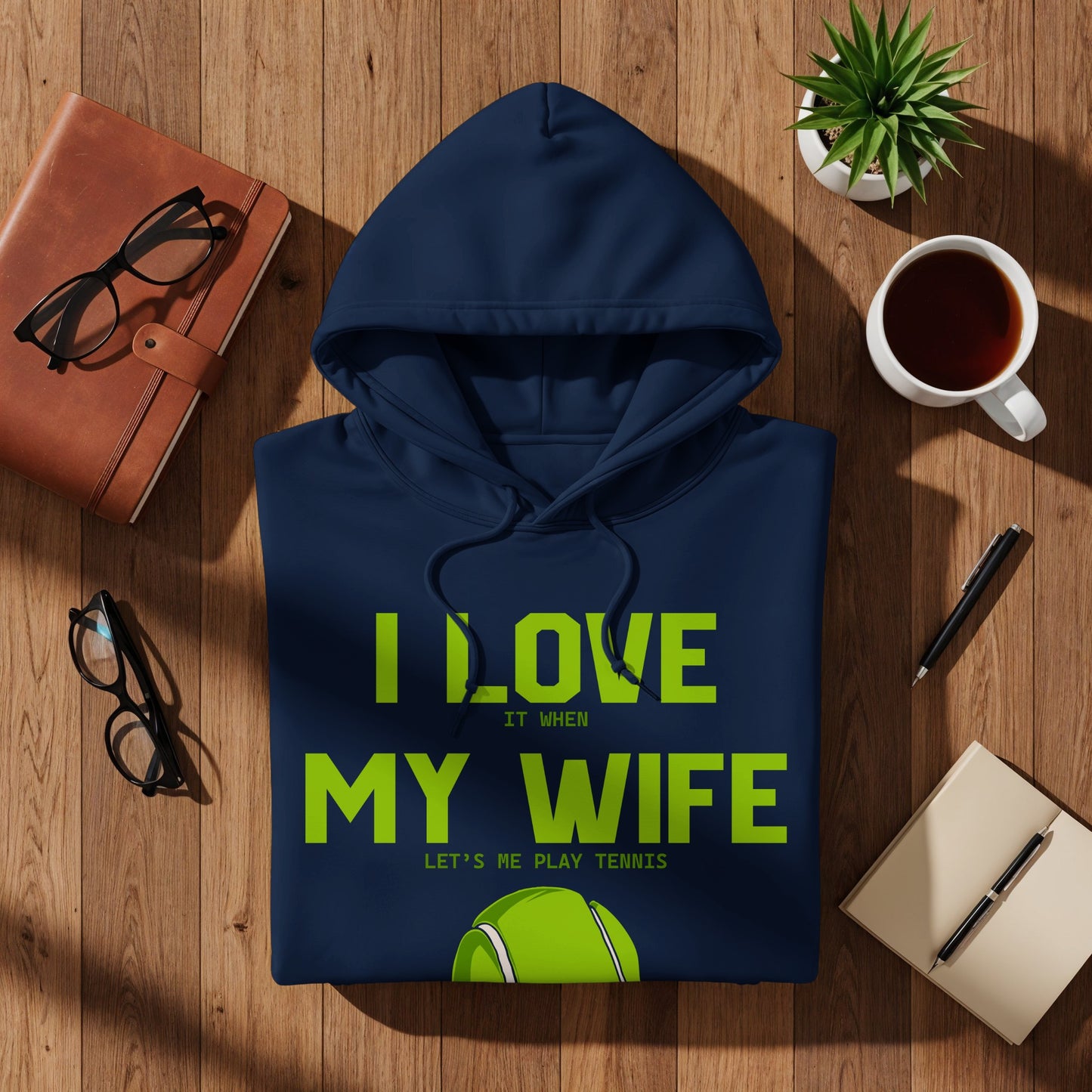 Navy hoodie with "I LOVE MY WIFE LET'S PLAY TENNIS" text and tennis ball graphic.