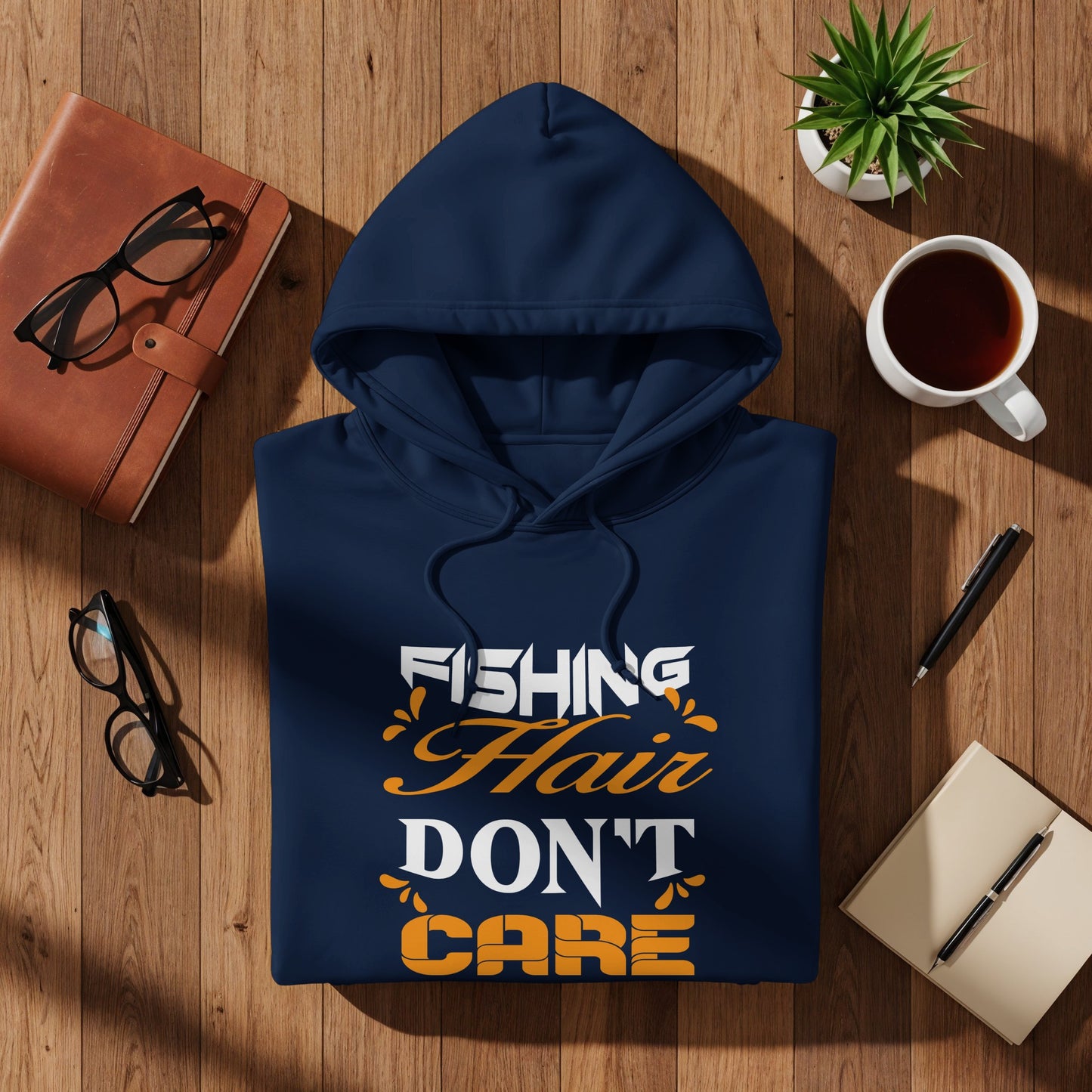 Navy hoodie with "Fishing Hair Don't Care" text design.