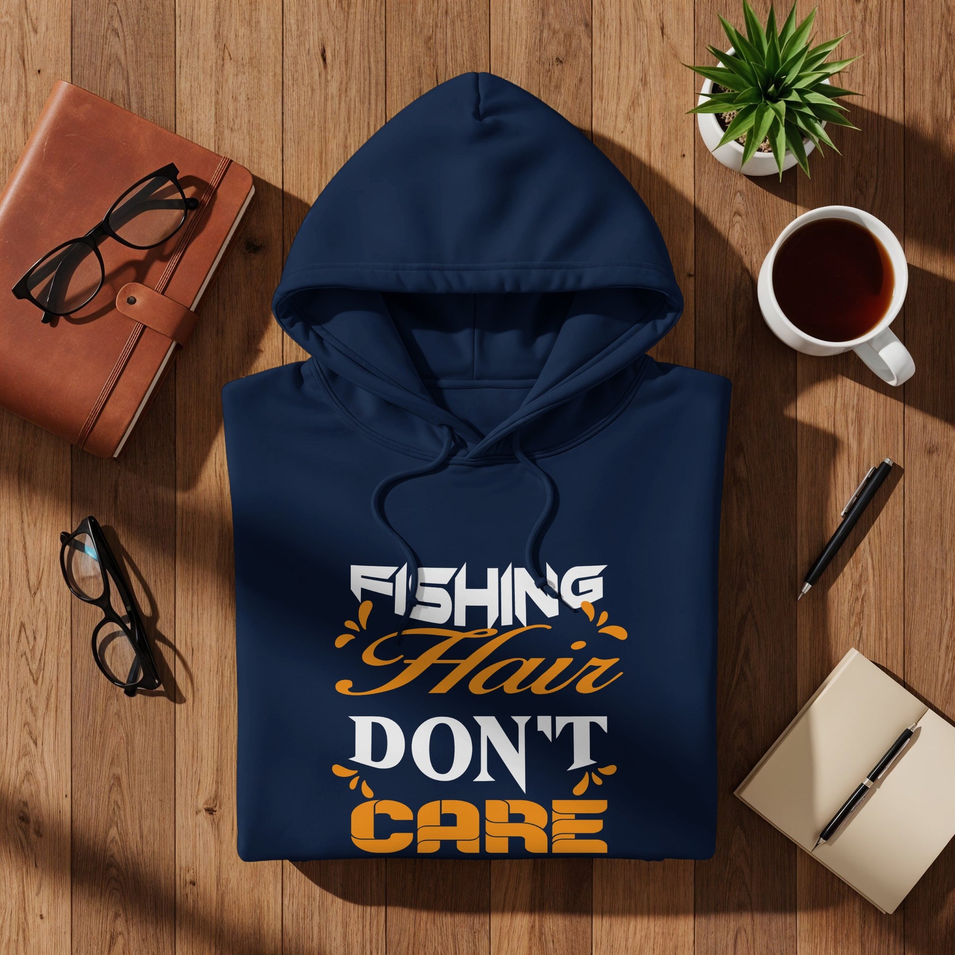 Navy hoodie with "Fishing Hair Don't Care" text design.