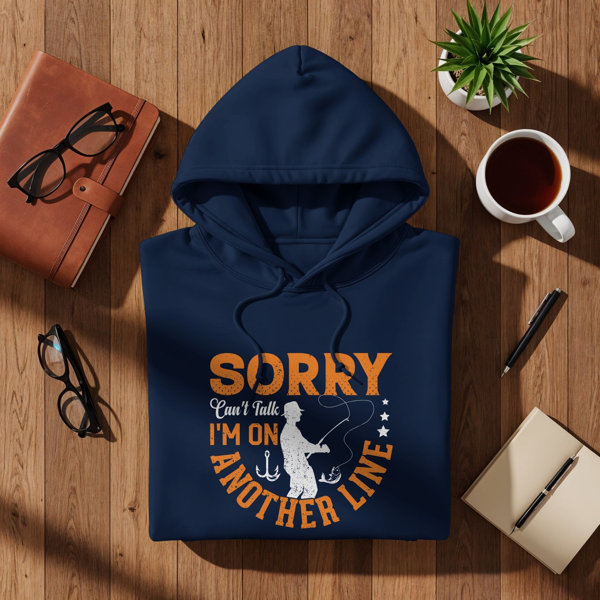 Navy blue hoodie with "SORRY I'M ON ANOTHER LINE" fishing graphic.