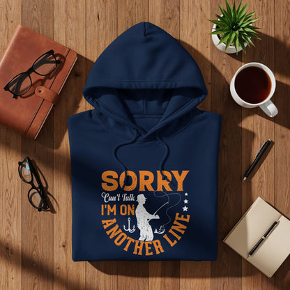 Navy blue hoodie with "SORRY I'M ON ANOTHER LINE" fishing graphic.
