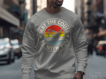 Gray sweatshirt with "May the Course be with you" and a golf ball.