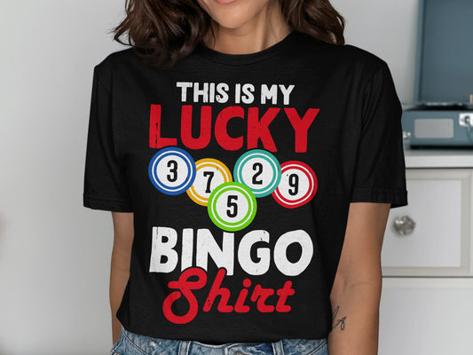 Black t-shirt with "THIS IS MY LUCKY BINGO Shirt" and colorful bingo balls.