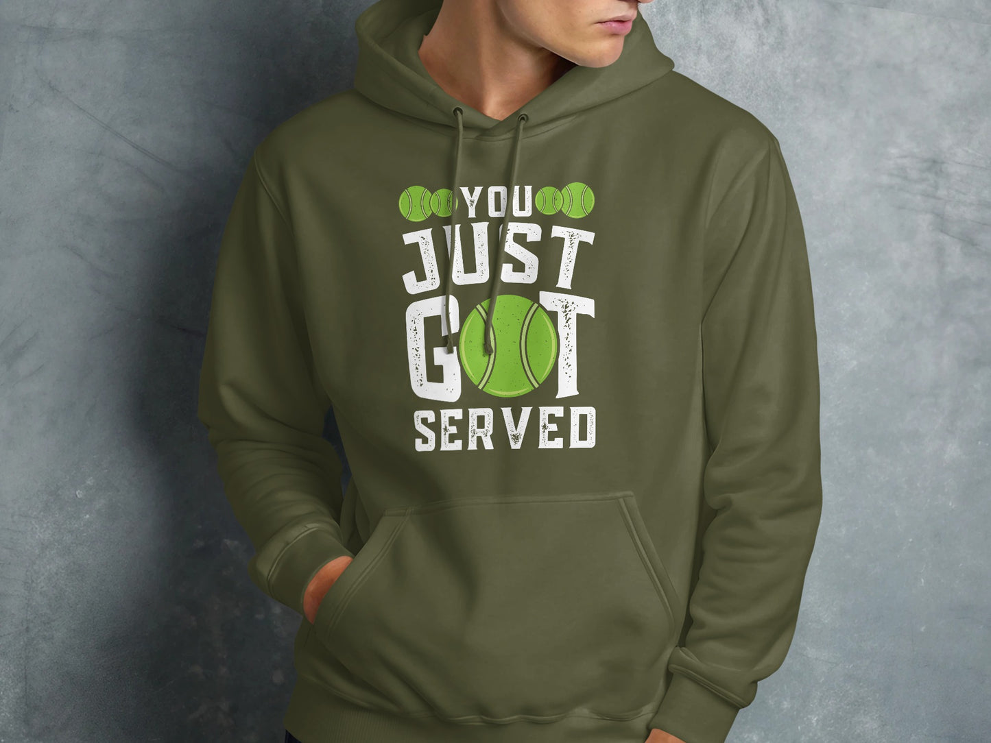 Green hooded sweatshirt with white text "YOU JUST GOT SERVED" and a tennis ball.