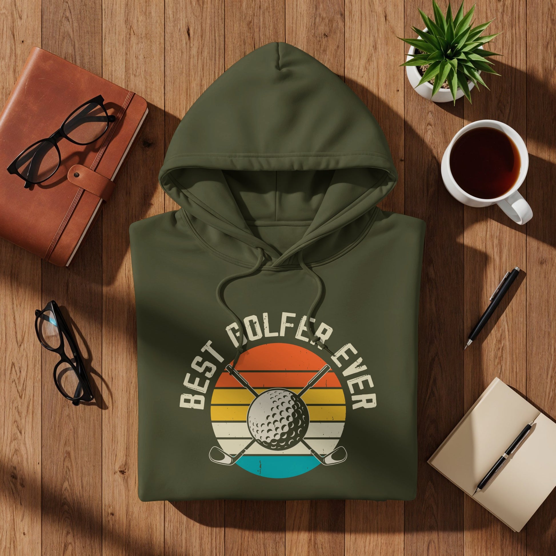 Green hoodie with "Best Golfer Ever" text and golf club and ball graphic.