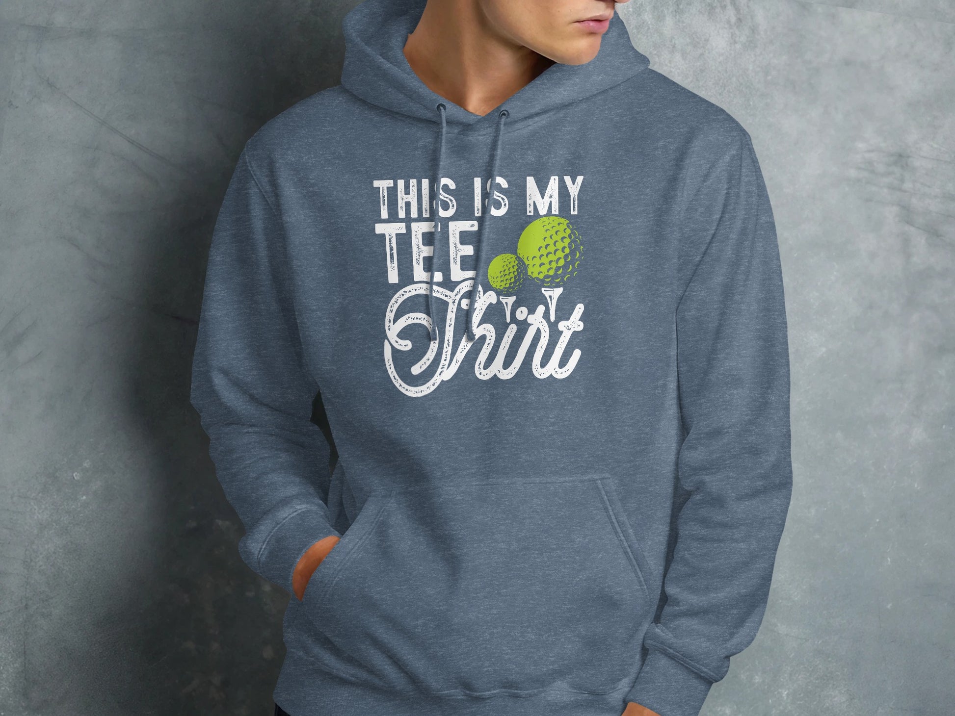 Blue hoodie with white text and golf balls reading "This is my tee shirt".