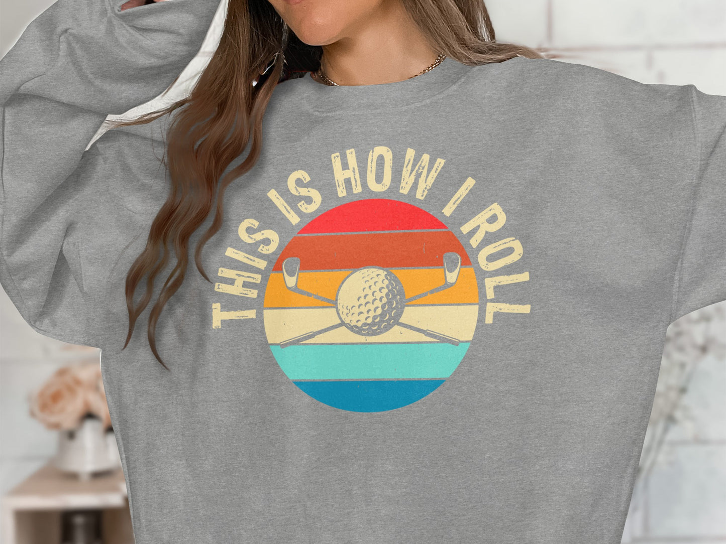 Gray sweatshirt with "This is How I Roll" text over a golf club and ball graphic.