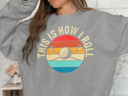 Gray sweatshirt with "This is How I Roll" text over a golf club and ball graphic.