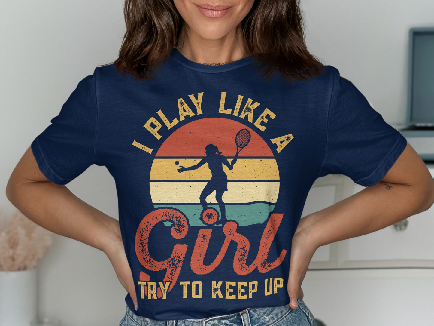 Navy t-shirt with "I Play Like A Girl Try To Keep Up" and tennis player graphic.