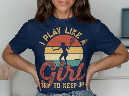 Navy t-shirt with "I Play Like A Girl Try To Keep Up" and tennis player graphic.