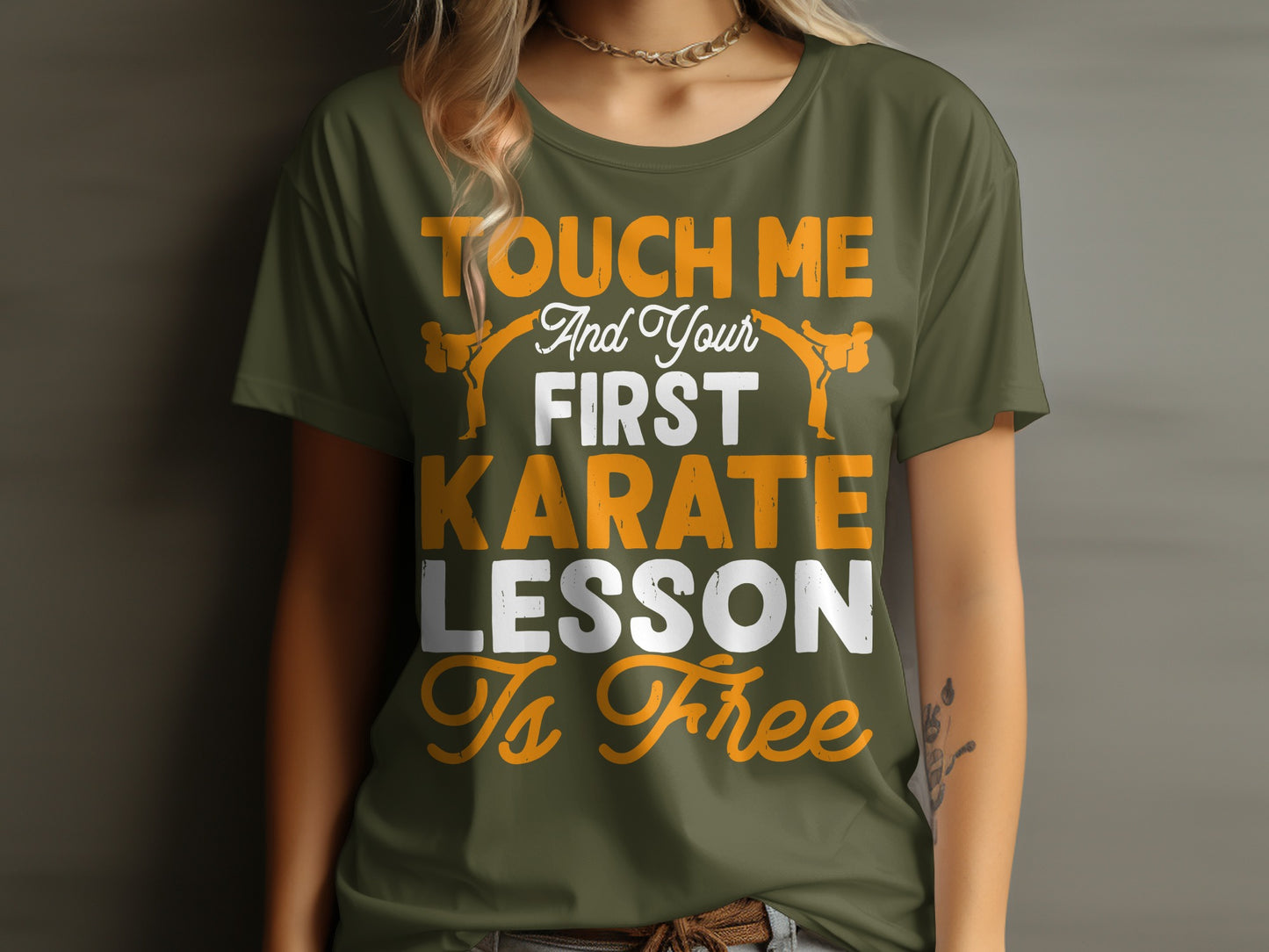 Olive green t-shirt with orange and white text, "And Your First Karate Lesson Is Free".