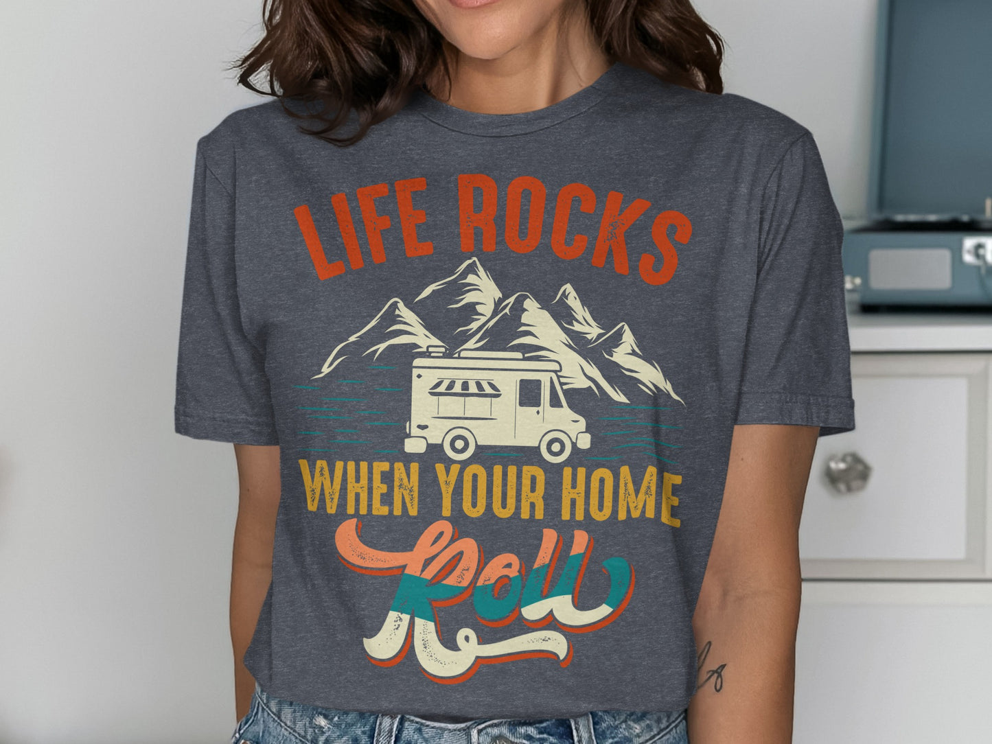 Graphic t-shirt with "Life Rocks When Your Home Roll" and a camper van.