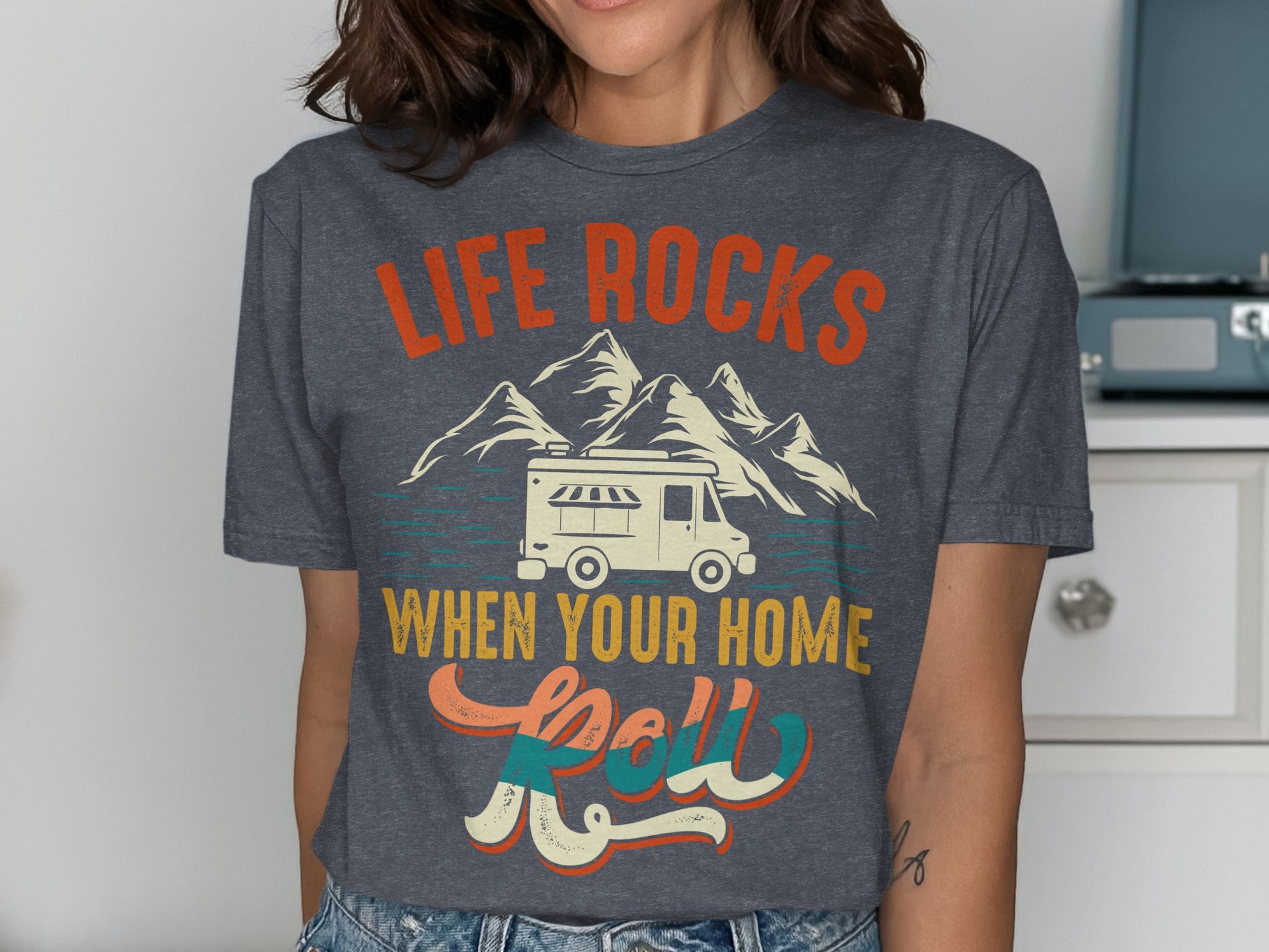 Graphic t-shirt with "Life Rocks When Your Home Roll" and a camper van.