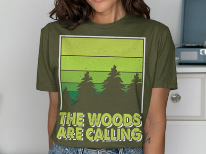 Green t-shirt with forest graphic and "THE WOODS ARE CALLING" text.