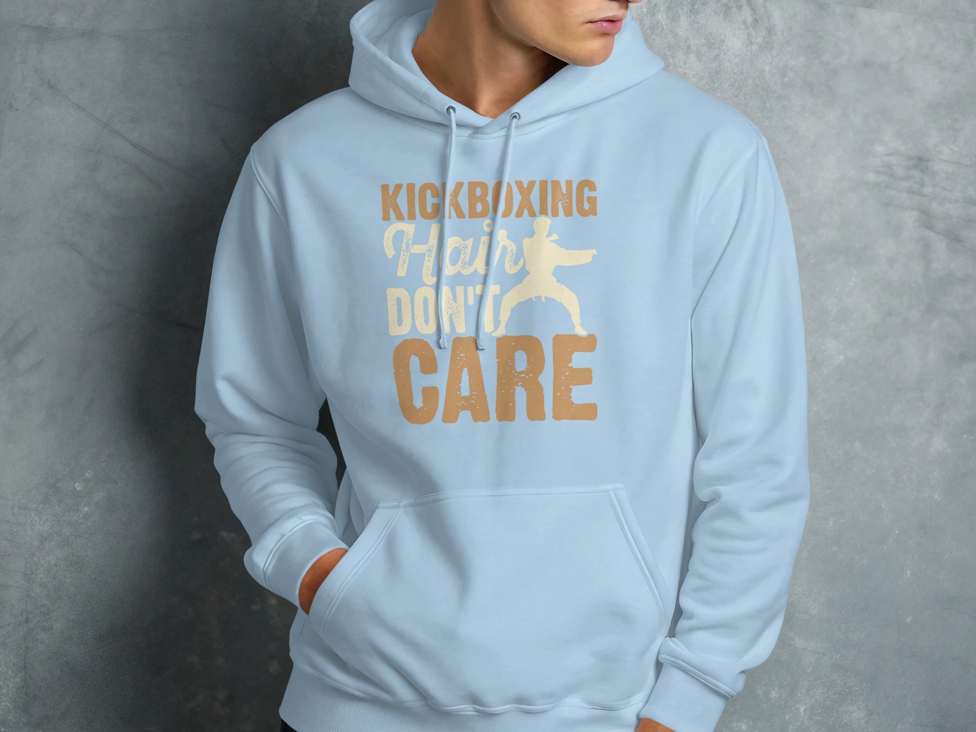 Light blue hoodie with "Kickboxing Hair Don't Care" graphic.