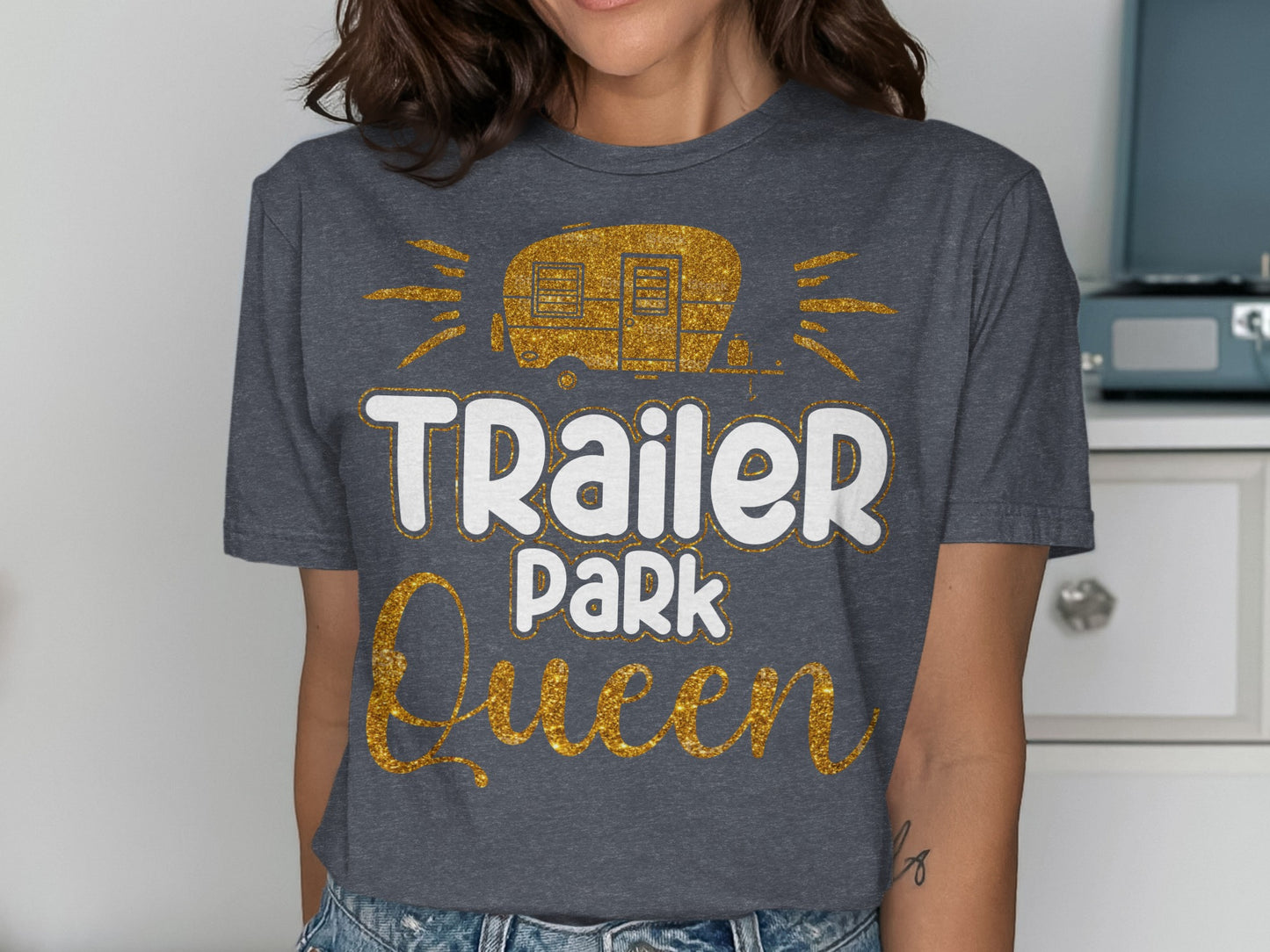 "Trailer Park Queen" graphic t-shirt with glittery caravan design.