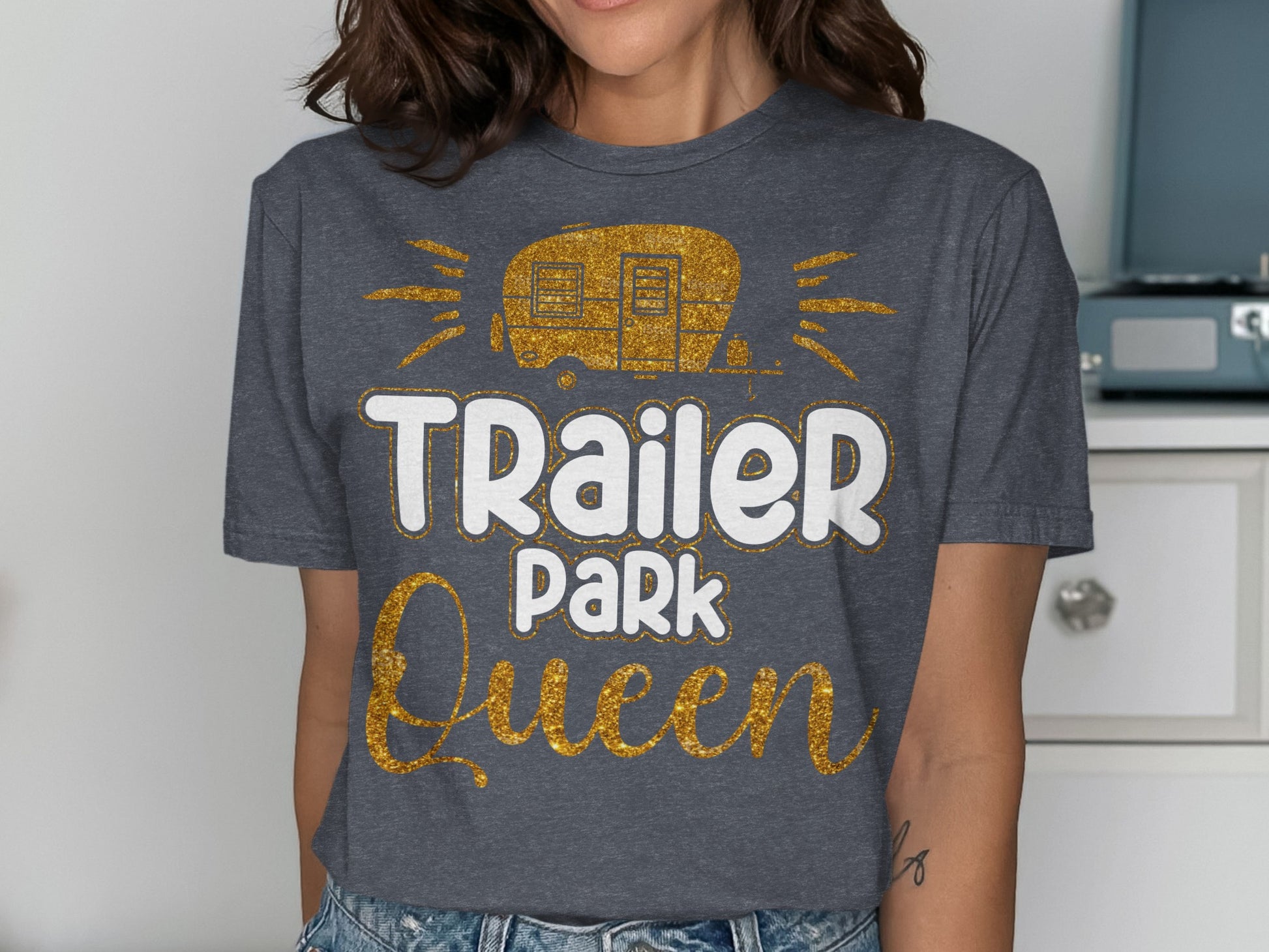 "Trailer Park Queen" graphic t-shirt with glittery caravan design.