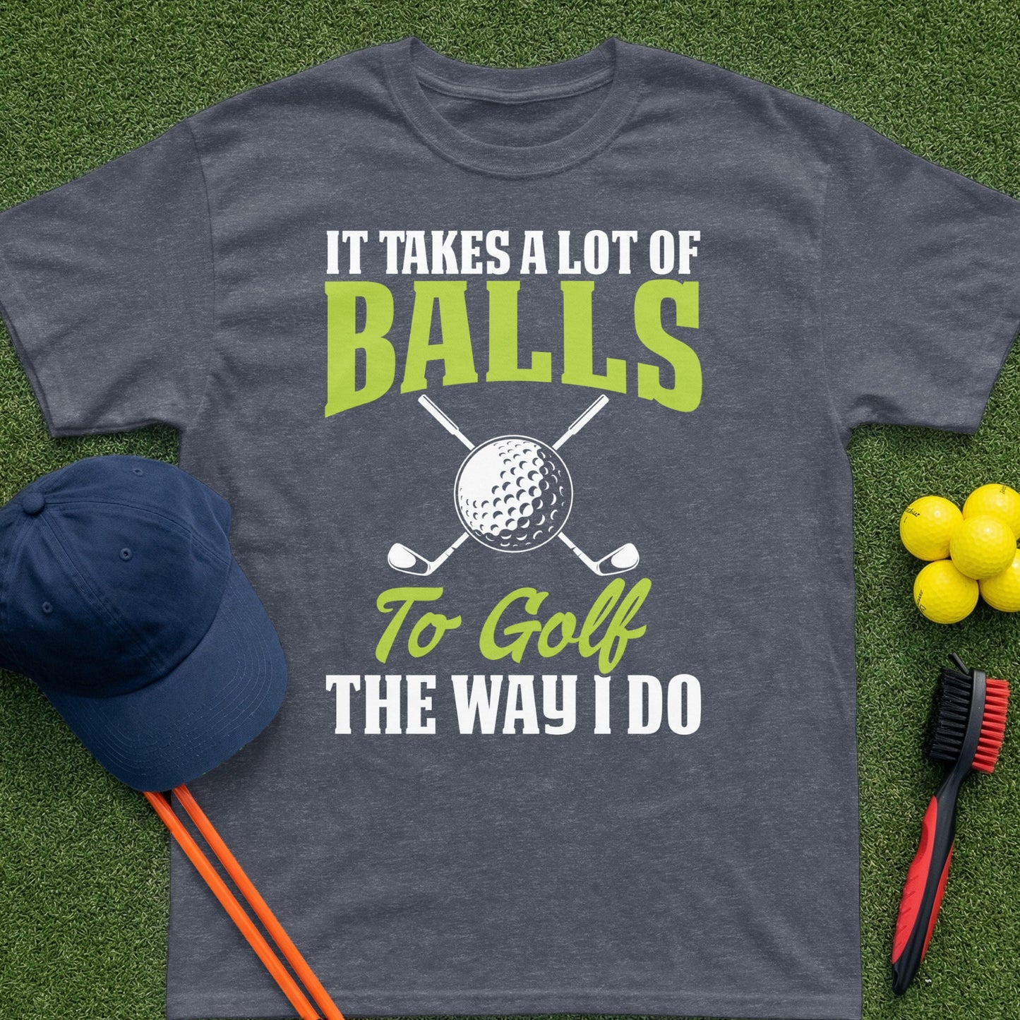 Dark gray t-shirt with "It Takes a Lot of Balls To Golf The Way I Do" text and golf graphics.