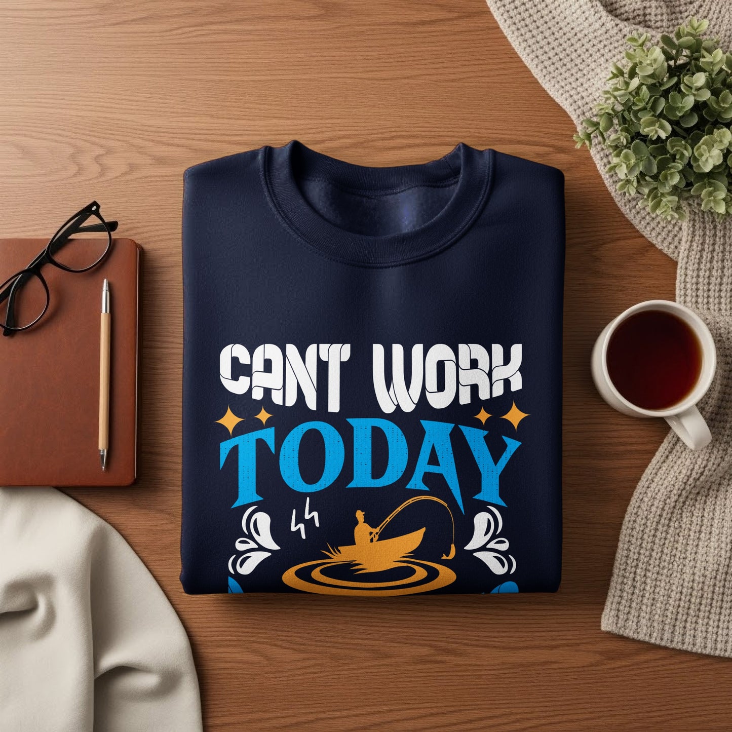 Navy sweatshirt with "Can't work today" and fishing graphic.