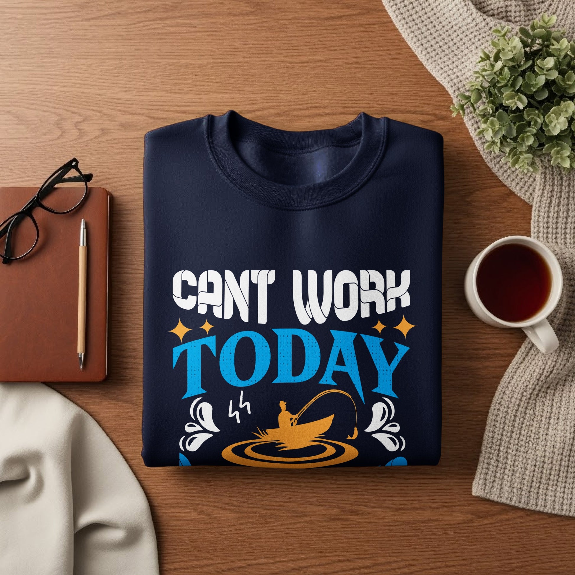 Navy sweatshirt with "Can't work today" and fishing graphic.