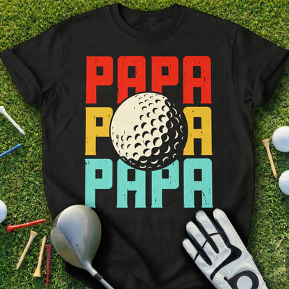 Black t-shirt with "PAPA" text in red, yellow, and blue, featuring a golf ball.