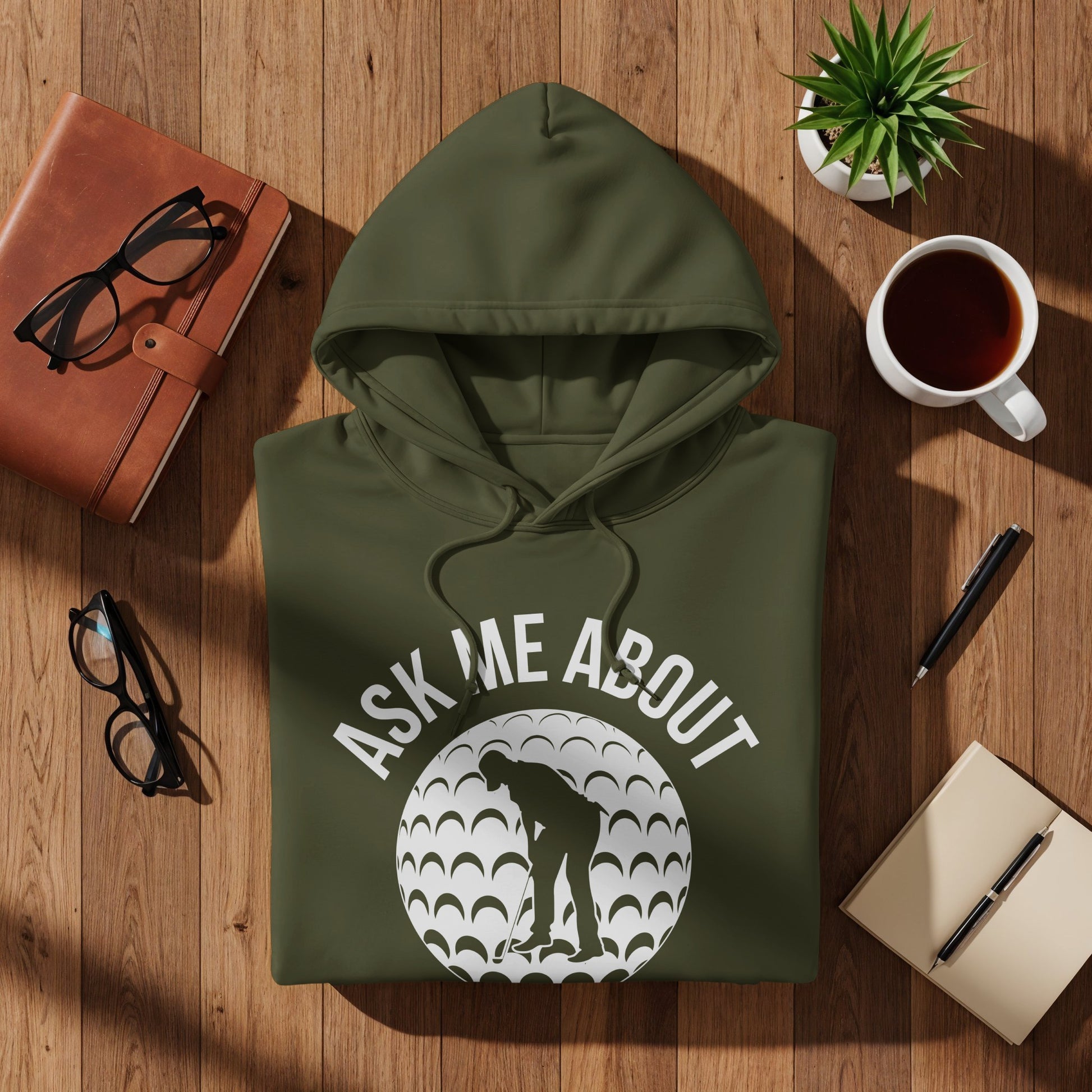Olive green hoodie with "Ask Me About Golf" text and golfer graphic.