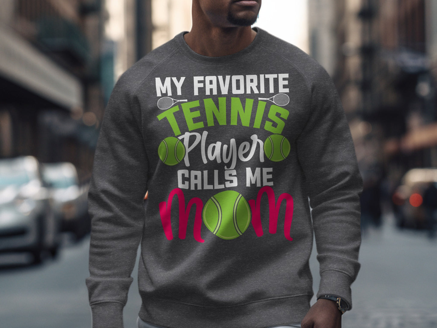 Gray sweatshirt with "My Favorite Tennis Player Calls Me" text and tennis balls.