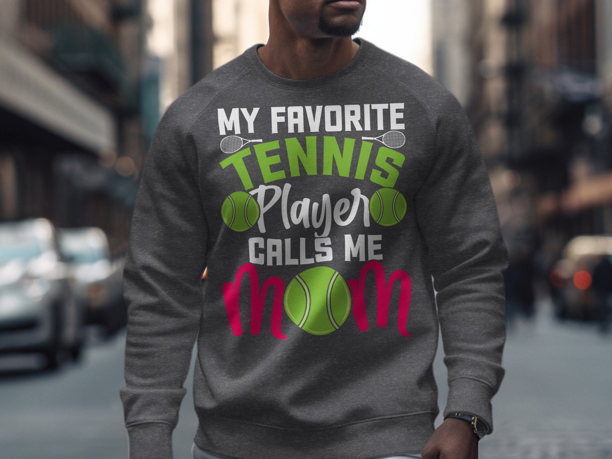 Gray sweatshirt with "My Favorite Tennis Player Calls Me" text and tennis balls.