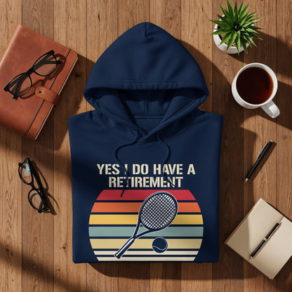 Navy hoodie with "Yes, I do have a retirement" text and tennis graphic.
