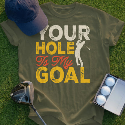 Green t-shirt with "Your Hole Is My Goal" text and golf graphic.