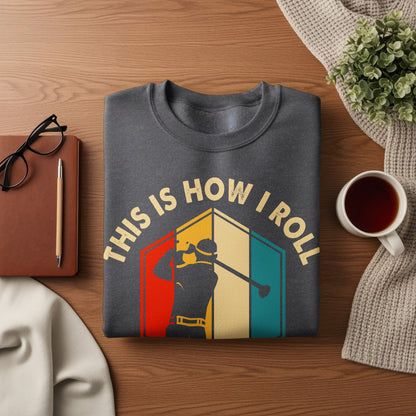 Dark gray sweatshirt with "THIS IS HOW I ROLL" text and a golfer graphic.