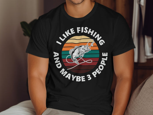 Black t-shirt with text "I LIKE FISHING AND MAYBE 3 PEOPLE" and a leaping fish graphic.