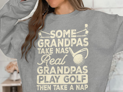 Gray sweatshirt with "Some Grandpas Take Nas Real Grandpas Play Golf Then Take A Nap" text.