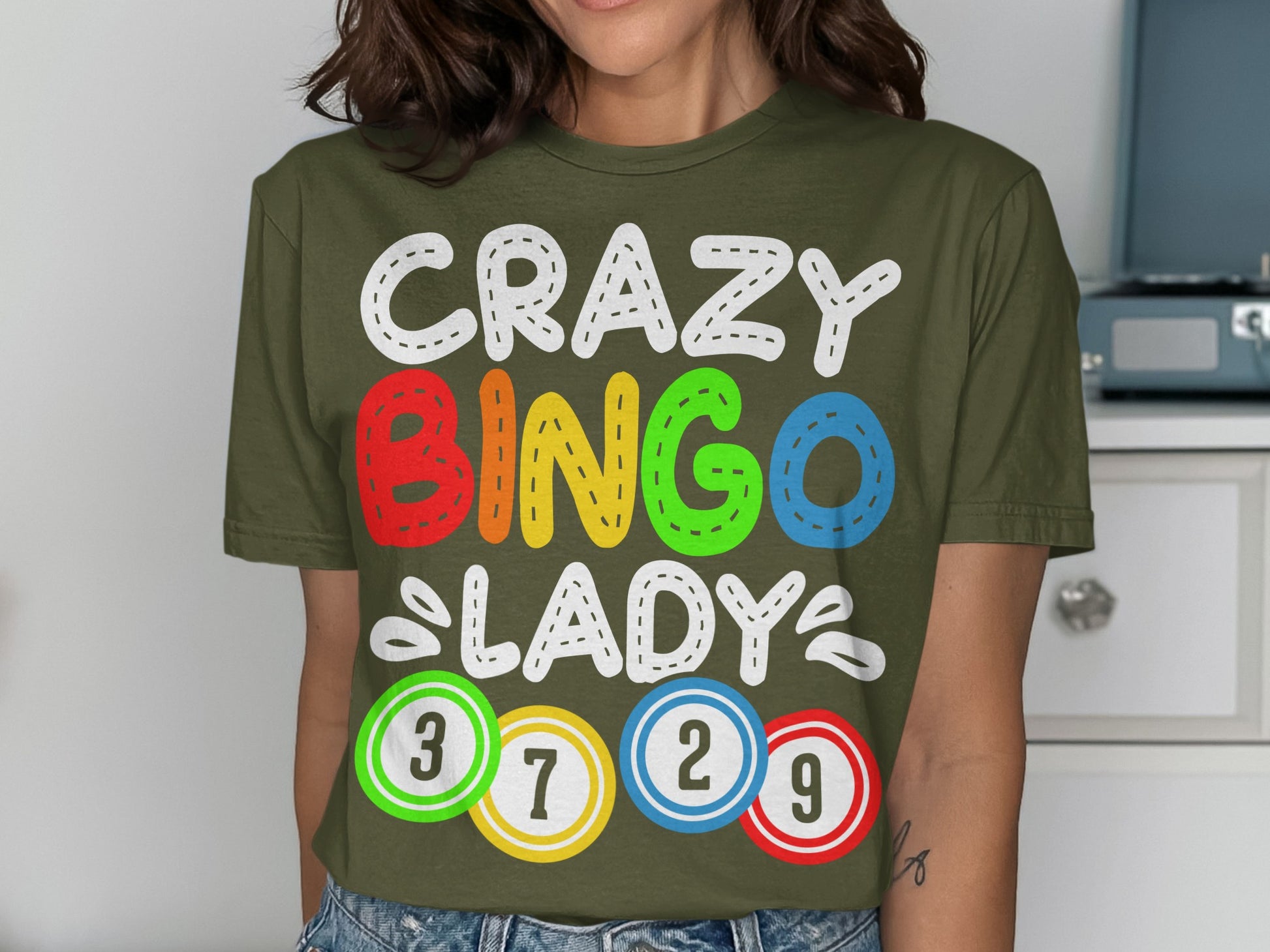 Olive green t-shirt with "CRAZY BINGO LADY" and numbered bingo balls.
