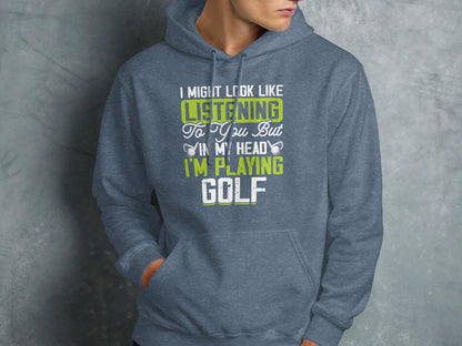Gray hoodie with "I might look like listening to you but in my head I'm playing golf" text.